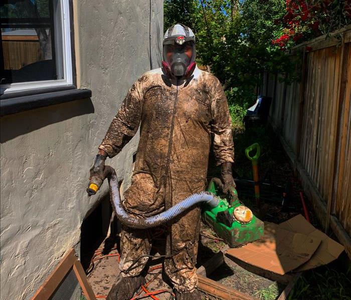 SERVPRO of Mid-City San Diego production tech muddy from head to toe